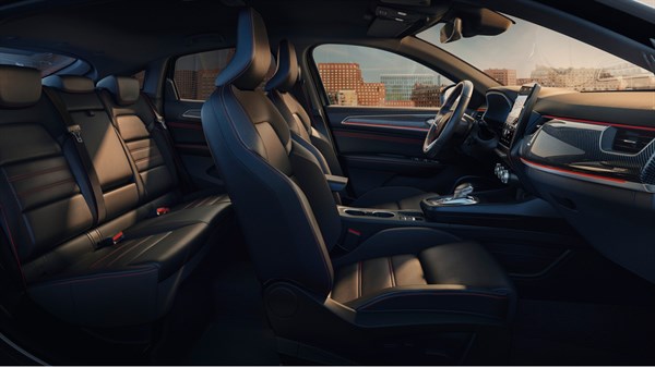 inside the renault arkana from point of view of the front right seat. Outside the car there are buildings