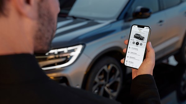 a man using renault app at his smartphone