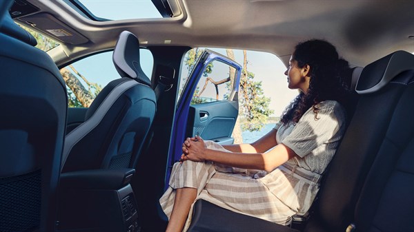 a woman sitting in the backseats of renault captur