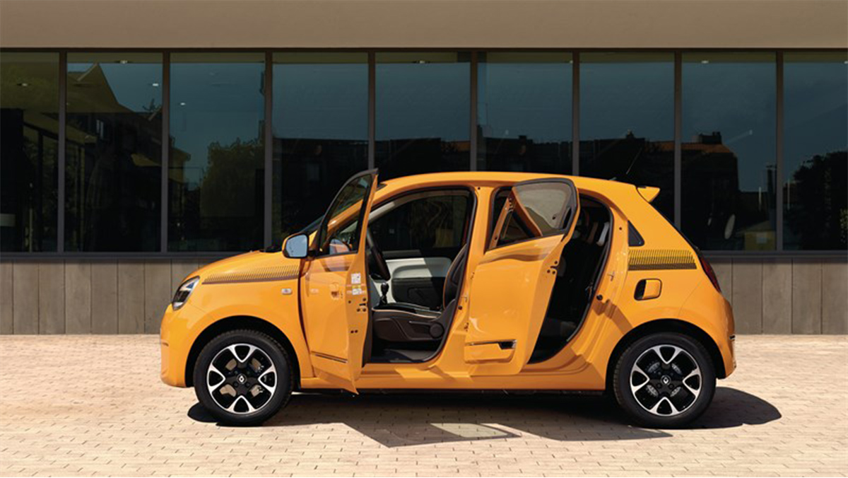 A yellow twingo from the left side and with open doors