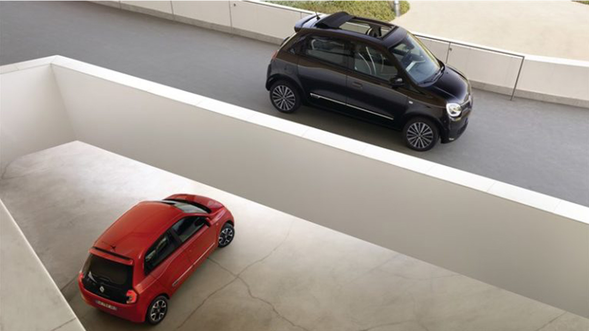 two twingo cars one red and one black. The red one is basement and the black one on first floor